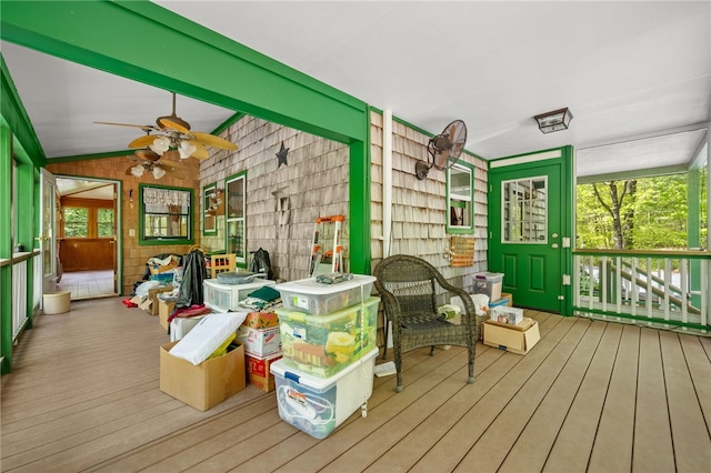 sunroom / solarium featuring ceiling fan and lofted ceiling