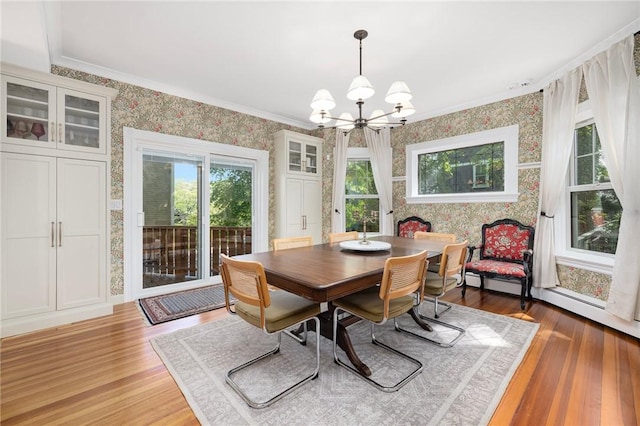 3 Hidden St, Providence, RI 02906 - dining room with a chandelier, wallpapered walls, healthy amount of natural light, wood finished floors, and ornamental molding