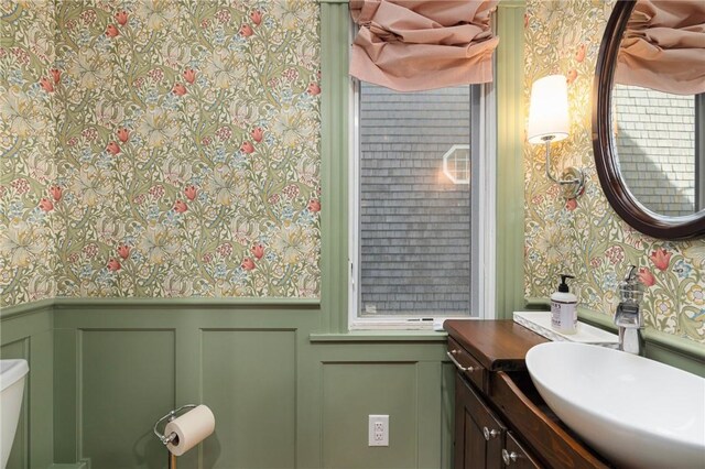 3 Hidden St, Providence, RI 02906 - bathroom with wallpapered walls, a decorative wall, a wainscoted wall, and vanity