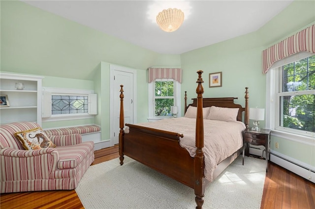 3 Hidden St, Providence, RI 02906 - bedroom with wood finished floors and a baseboard heating unit