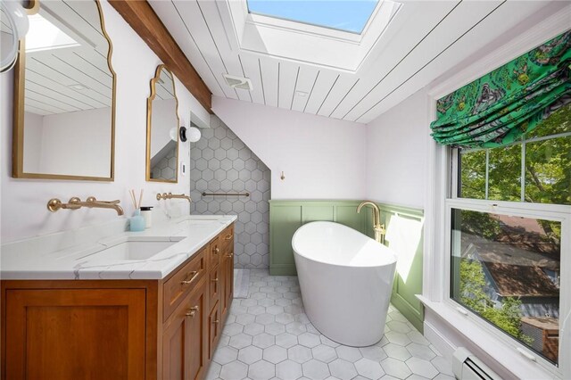 3 Hidden St, Providence, RI 02906 - full bathroom with a soaking tub, double vanity, a baseboard radiator, a skylight, and wainscoting