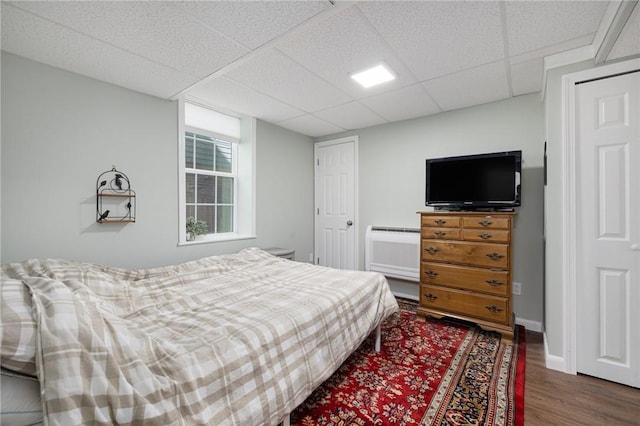 3 Hidden St, Providence, RI 02906 - bedroom featuring wood finished floors, a paneled ceiling, and baseboards