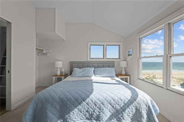 419 Atlantic Ave, Westerly, RI 02891 - bedroom featuring carpet floors, a water view, vaulted ceiling, and baseboards