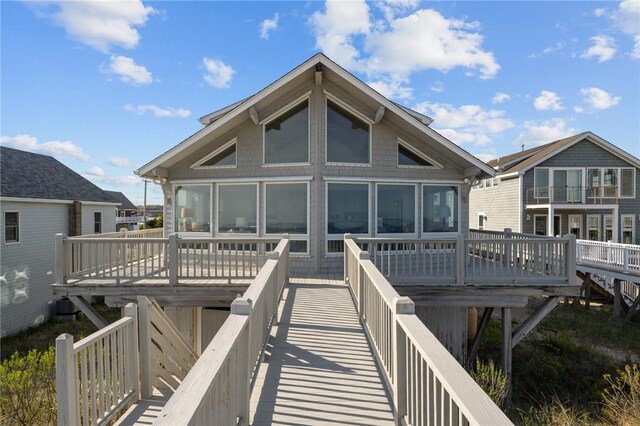 419 Atlantic Ave, Westerly, RI 02891 - back of property featuring a sunroom and a wooden deck