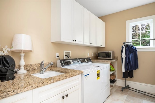 136 Adams Point Rd, Barrington, RI 02806 - laundry room featuring washer and clothes dryer, cabinet space, and baseboards