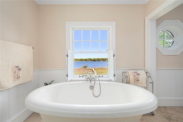 136 Adams Point Rd, Barrington, RI 02806 - full bath with wainscoting, a soaking tub, a water view, and a decorative wall
