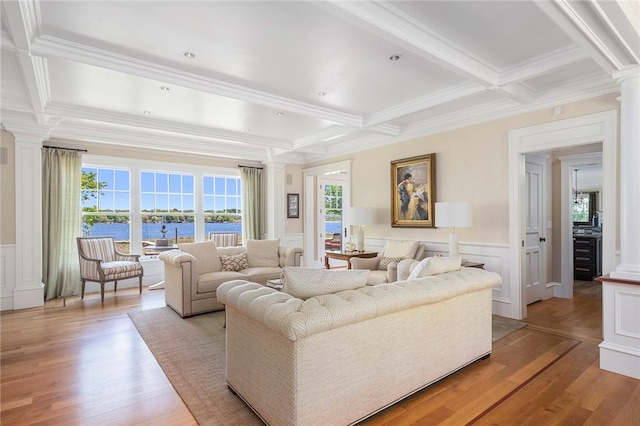 136 Adams Point Rd, Barrington, RI 02806 - living area with ornate columns, a wainscoted wall, a decorative wall, ornamental molding, and light wood-style floors