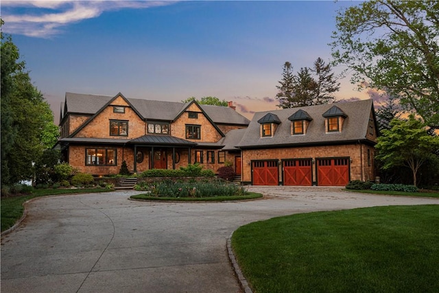 136 Adams Point Rd, Barrington, RI 02806 - shingle-style home featuring curved driveway, a front yard, and a standing seam roof
