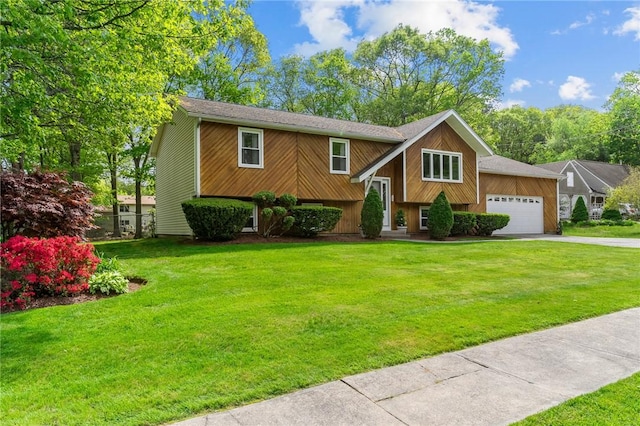 23 Watercress Ct, Coventry, RI 02816 - view of front of property featuring a garage, driveway, and a front yard