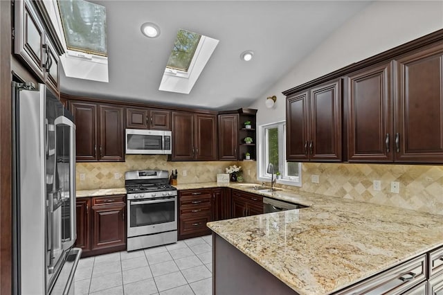 23 Watercress Ct, Coventry, RI 02816 - kitchen featuring appliances with stainless steel finishes, a sink, a skylight, open shelves, and light tile patterned floors