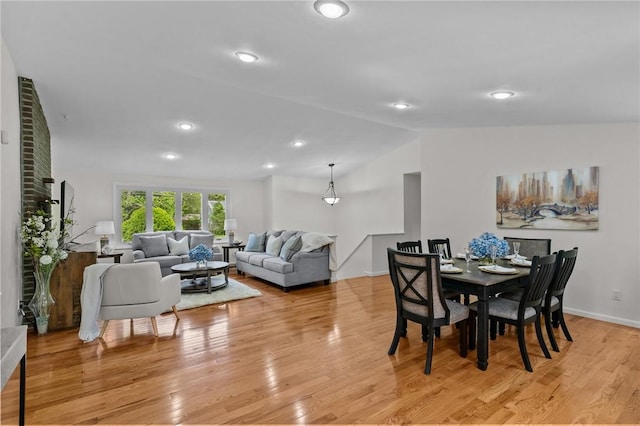 23 Watercress Ct, Coventry, RI 02816 - dining space with vaulted ceiling and light wood-style floors