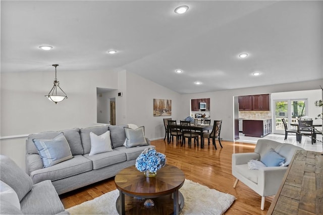 23 Watercress Ct, Coventry, RI 02816 - living room featuring vaulted ceiling, recessed lighting, light wood-style flooring, and baseboards