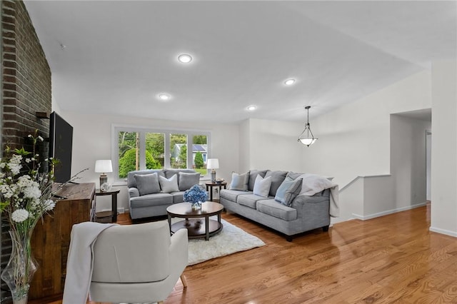 23 Watercress Ct, Coventry, RI 02816 - living area featuring wood finished floors, lofted ceiling, recessed lighting, and baseboards