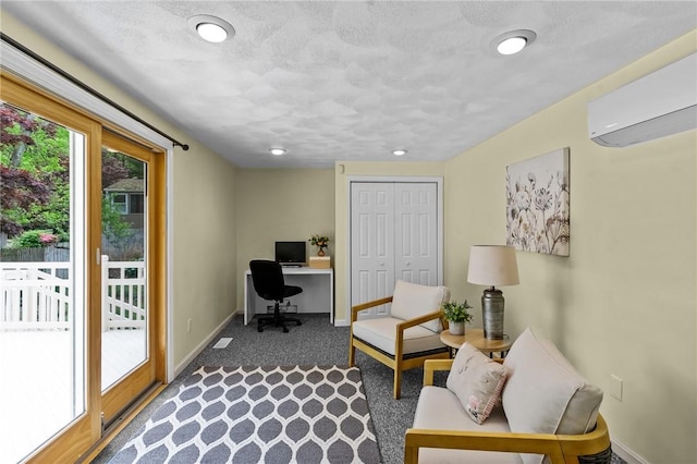 23 Watercress Ct, Coventry, RI 02816 - office space featuring a wall mounted AC, baseboards, carpet, and a textured ceiling