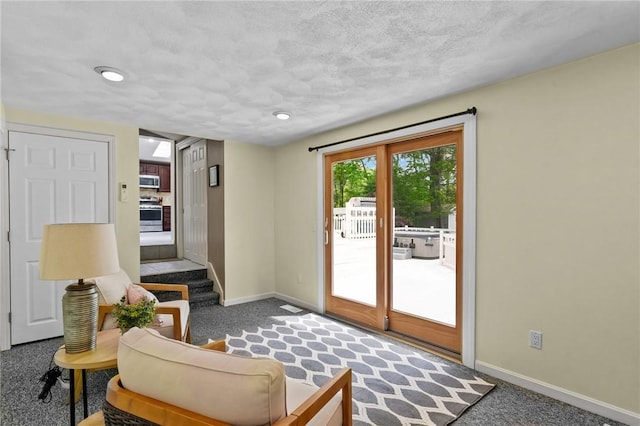 23 Watercress Ct, Coventry, RI 02816 - sitting room featuring carpet flooring, baseboards, and a textured ceiling