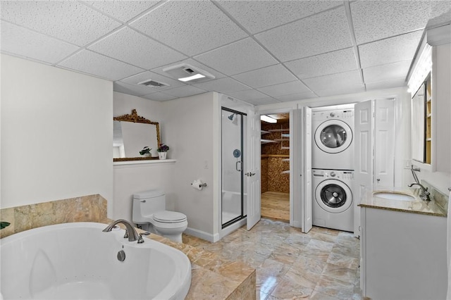 23 Watercress Ct, Coventry, RI 02816 - full bathroom featuring stacked washer / dryer, a stall shower, a tub, a paneled ceiling, and vanity