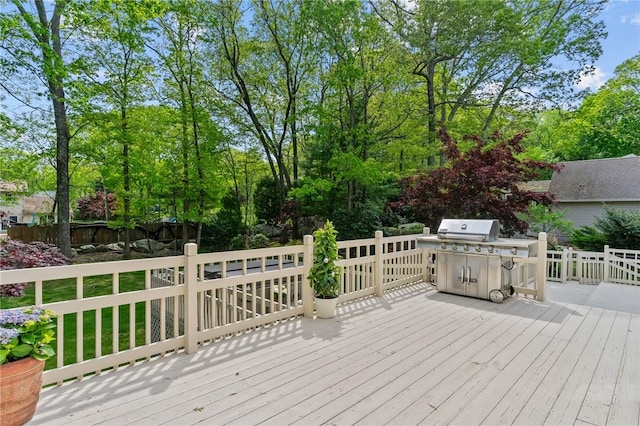 23 Watercress Ct, Coventry, RI 02816 - wooden terrace with fence, grilling area, and view of scattered trees