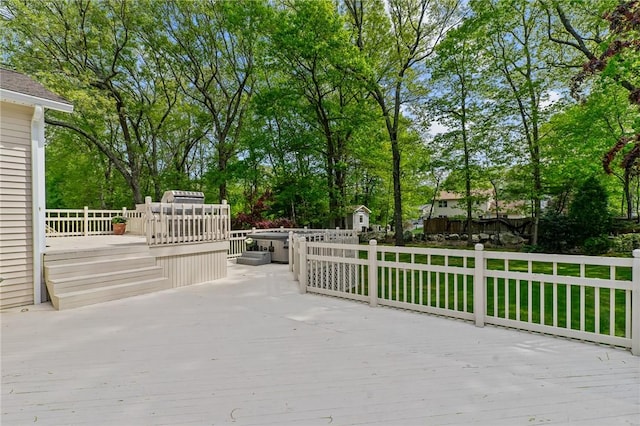 23 Watercress Ct, Coventry, RI 02816 - wooden deck featuring view of scattered trees and an outdoor structure