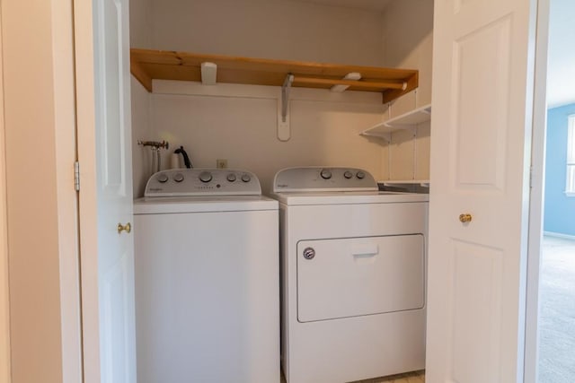 washroom with independent washer and dryer