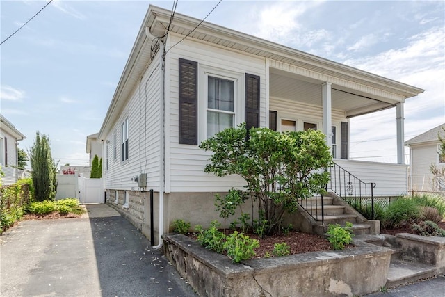 94 Bentley St, East Providence, RI 02914 - view of front of home with a gate and a porch