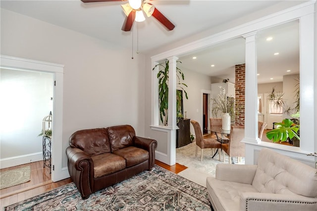94 Bentley St, East Providence, RI 02914 - living area featuring decorative columns, wood finished floors, ceiling fan, recessed lighting, and baseboards