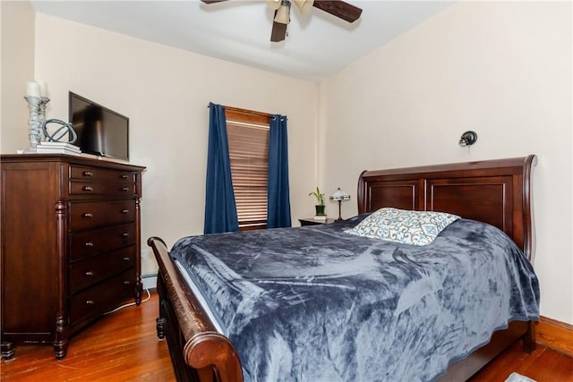 94 Bentley St, East Providence, RI 02914 - bedroom with dark wood-style floors, a ceiling fan, and a baseboard radiator