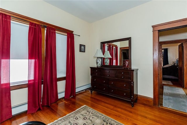 94 Bentley St, East Providence, RI 02914 - living area with wood finished floors and a baseboard radiator