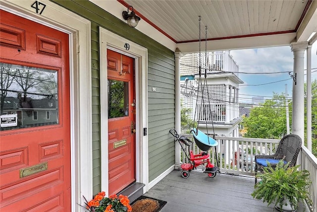 property entrance with covered porch