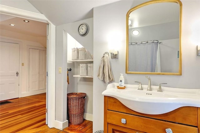bathroom with wood finished floors, vanity, recessed lighting, and a shower with shower curtain