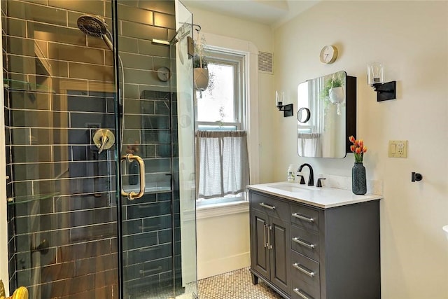 bathroom featuring a stall shower and vanity