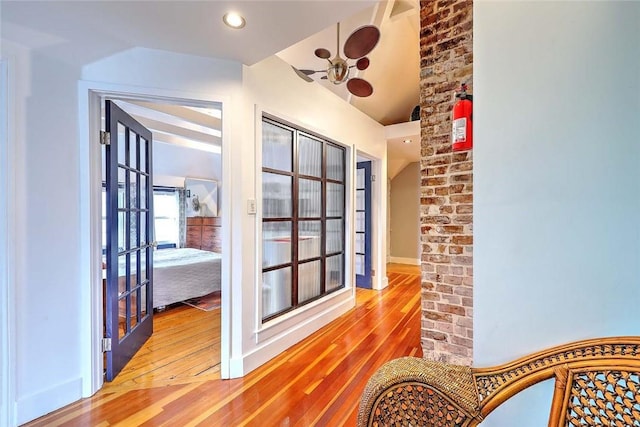 sunroom / solarium featuring french doors and lofted ceiling
