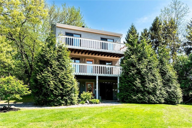 25 Spanker St, Jamestown, RI 02835 - view of front of house with a front lawn and a balcony