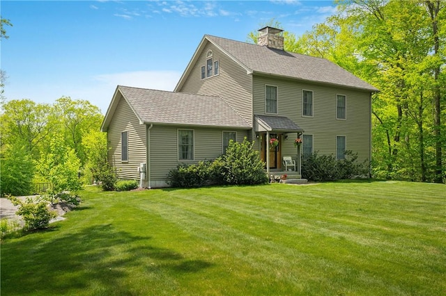 764 Central Pike, Scituate, RI 02857 - view of front of house featuring a front lawn, a chimney, and a shingled roof