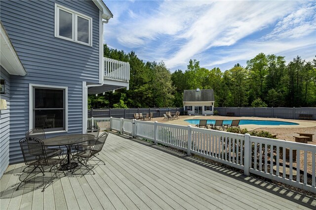 101 Nancy Ln, Burrillville, RI 02830 - wooden terrace with outdoor dining area, fence, and an outbuilding