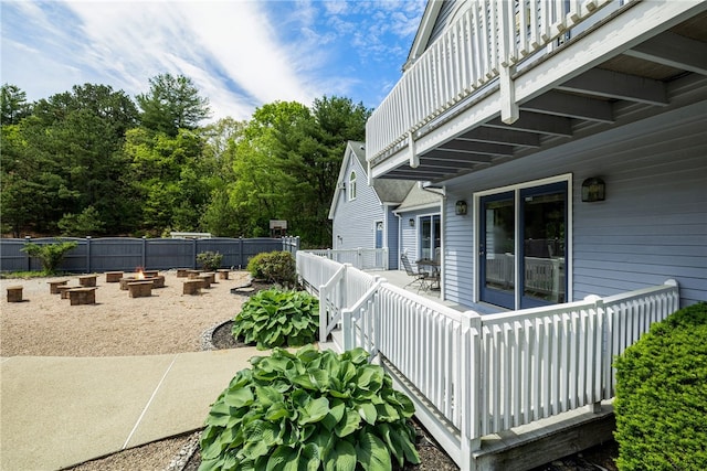 101 Nancy Ln, Burrillville, RI 02830 - view of patio / terrace featuring a balcony, fence, and a fire pit