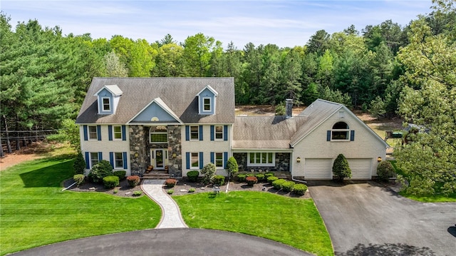 101 Nancy Ln, Burrillville, RI 02830 - view of front facade featuring stone siding, asphalt driveway, and a front lawn