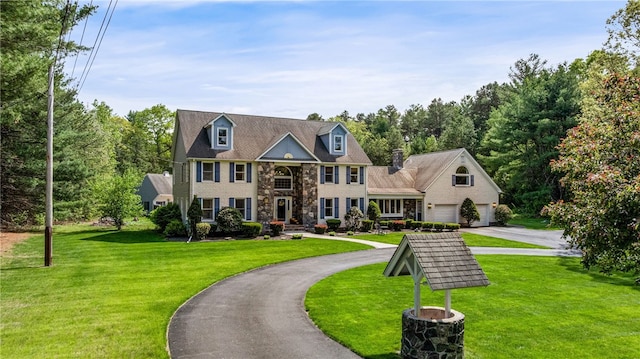 101 Nancy Ln, Burrillville, RI 02830 - view of front of house featuring asphalt driveway, stone siding, and a front yard