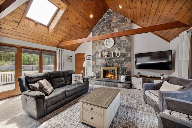 101 Nancy Ln, Burrillville, RI 02830 - carpeted living room featuring a skylight, wood ceiling, a fireplace, and high vaulted ceiling