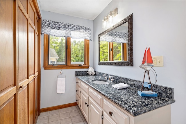 101 Nancy Ln, Burrillville, RI 02830 - bathroom featuring vanity, tile patterned flooring, and baseboards