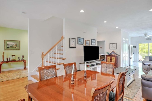 dining space featuring light wood-style flooring, stairway, recessed lighting, and ceiling fan