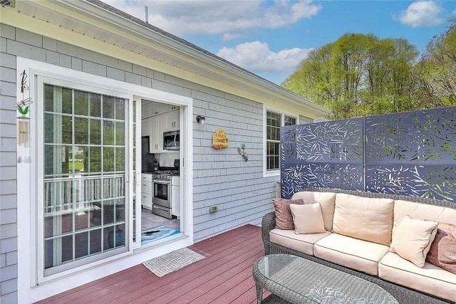 deck with an outdoor hangout area