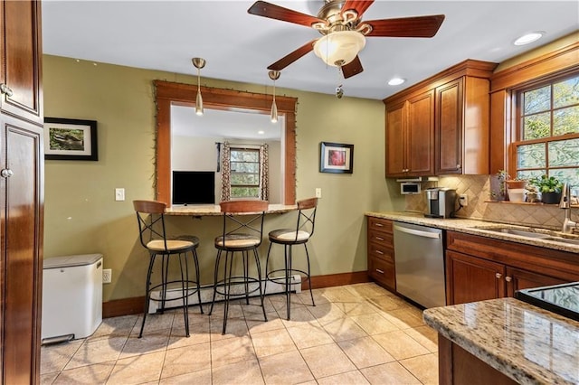 30 Miller Ave, East Providence, RI 02916 - kitchen featuring dishwasher, a sink, baseboards, tasteful backsplash, and fridge