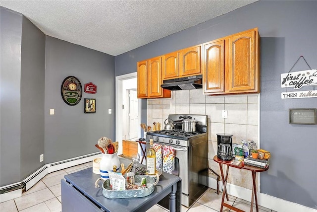 10 Westcott Ave Unit 1, Boston, MA 02124 - kitchen with stainless steel gas range oven, under cabinet range hood, light tile patterned flooring, tasteful backsplash, and a textured ceiling