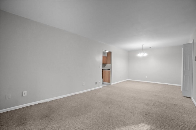 132 Fordson Ave Unit 11, Cranston, RI 02910 - unfurnished room featuring a chandelier, baseboards, and light colored carpet