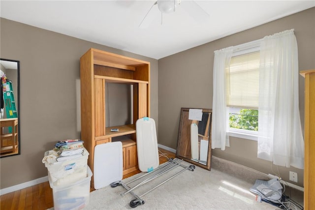 office area featuring baseboards and ceiling fan
