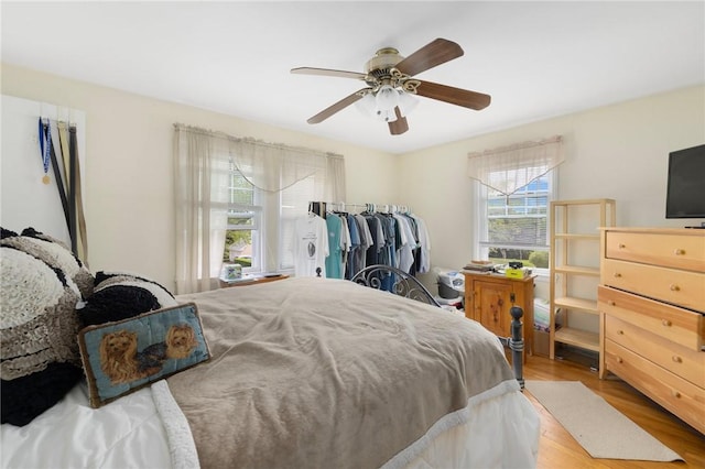 bedroom with wood finished floors and a ceiling fan