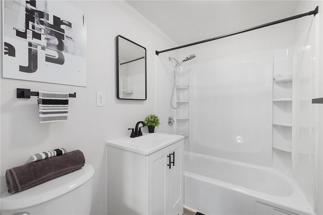 bathroom featuring toilet,  shower combination, and vanity