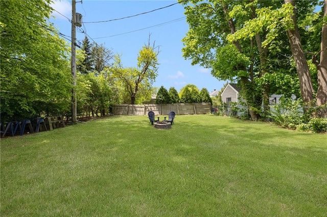 view of yard with an outdoor fire pit
