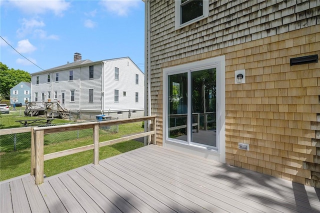deck featuring a lawn