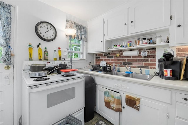 kitchen with white range with electric stovetop, open shelves, white cabinetry, light countertops, and a sink